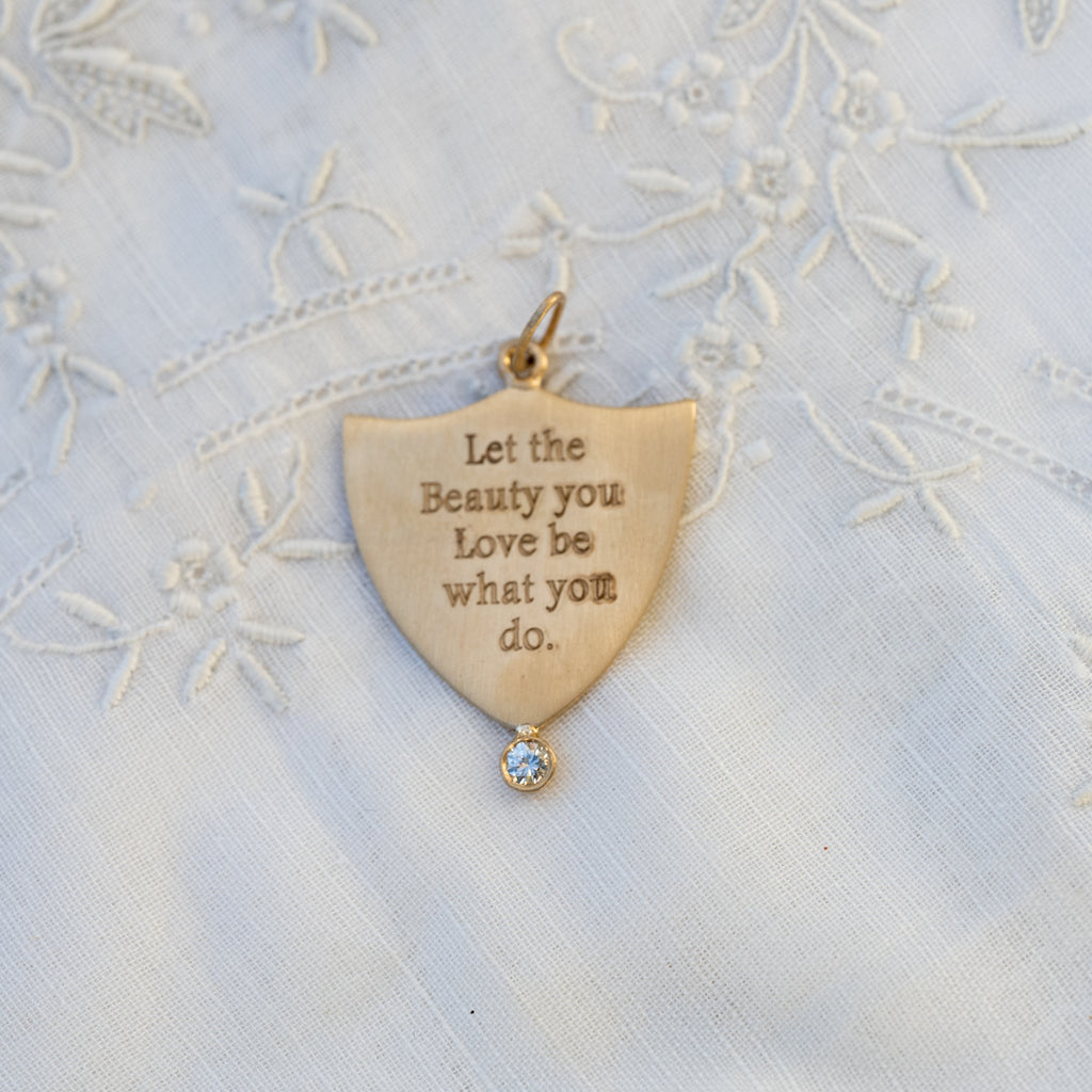Let the Beauty you Love be what you do Shield Pendant
